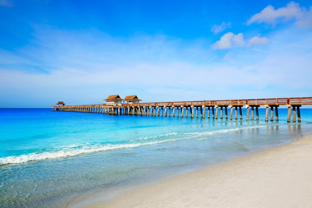 Naples Pier and beach on a sunny day