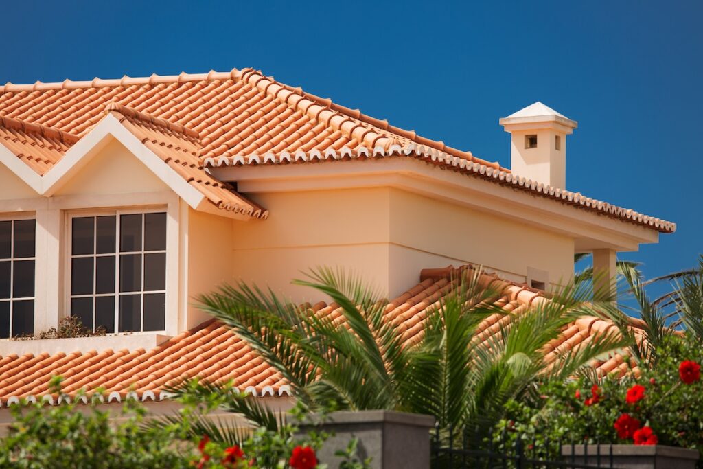 Orange tiled roof of a large house in tropical climate