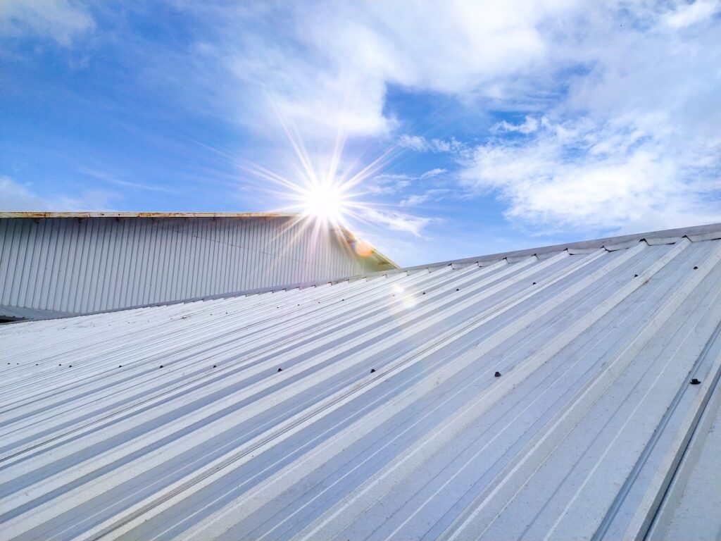 Metal roof with sun reflecting off of it