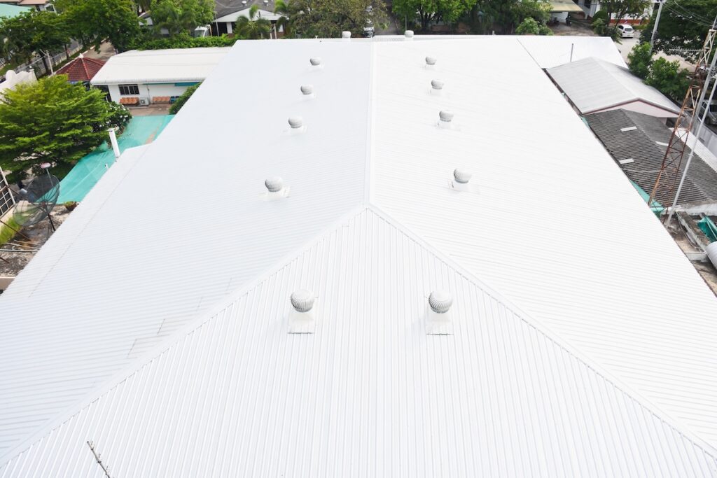 Beautiful gray metal sheet roof in commercial construction.