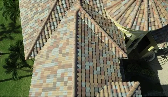 Roofing services provided by Cathedral Roofing Innovations in Bonita Springs, FL, showcasing a detailed tile roof.